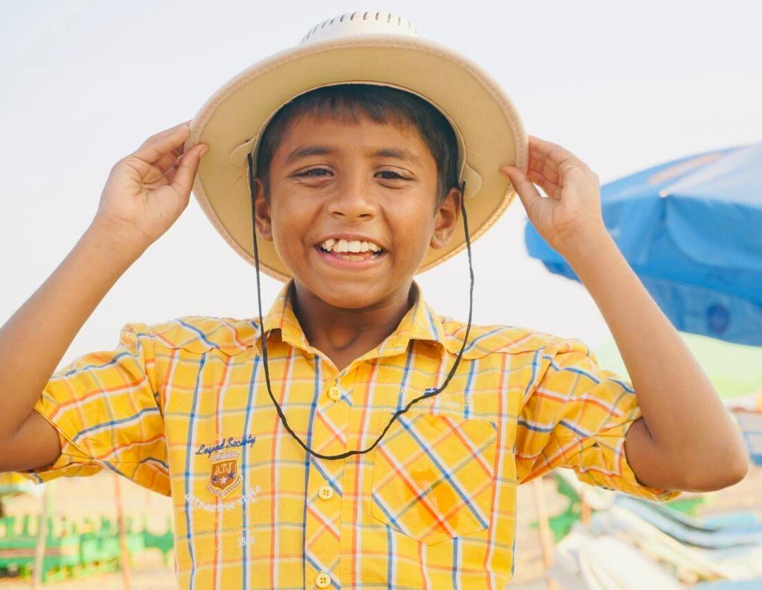 Smiling boy with hat